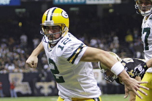 Green Bay Packers quarterback Aaron Rodgers (12) reacts after scoring a touchdown against the New Orleans Saints in the first half of an NFL football game in New Orleans, Monday, Nov. 24, 2008.\ (AP Photo/Alex Brandon)