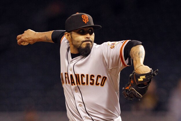 May 5, 2014; Pittsburgh, PA, USA; San Francisco Giants relief pitcher Sergio Romo (54) pitches against the Pittsburgh Pirates during the thirteenth inning at PNC Park. The San Francisco Giants won 11-10 in thirteen innings. Mandatory Credit: Charles LeClaire-USA TODAY Sports