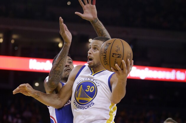 Golden State Warriors' Stephen Curry (30) drives against Los Angeles Clippers' Matt Barnes during the second half of a preseason NBA basketball game Tuesday, Oct. 21, 2014, in Oakland, Calif. (AP Photo/Ben Margot)