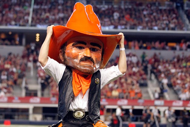 Aug 30, 2014; Arlington, TX, USA; Oklahoma State Cowboys mascot Pistol Pete on the field during a time out in the game against the Florida State Seminoles  at AT&T Stadium. Florida State beat Oklahoma State 37-31. Mandatory Credit: Tim Heitman-USA TODAY Sports