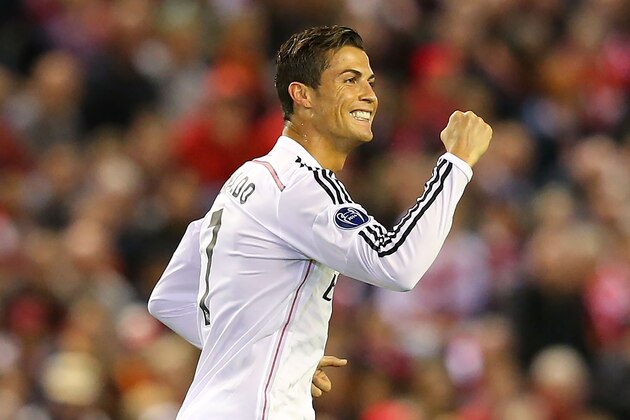 LIVERPOOL, ENGLAND - OCTOBER 22:  Cristiano Ronaldo of Real Madrid celebrates scoring the opening goal during the UEFA Champions League Group B match between Liverpool and Real Madrid CF on October 22, 2014 in Liverpool, United Kingdom.  (Photo by Alex Livesey/Getty Images)