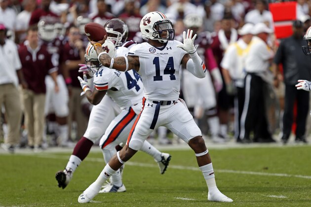 Auburn quarterback Nick Marshall (14) passes against Mississippi State during the first half of an NCAA college football game in Starkville, Miss., Saturday, Oct 11, 2014.  No.3 Mississippi State beat No. 2 Auburn 38-23. (AP Photo/Rogelio V. Solis)