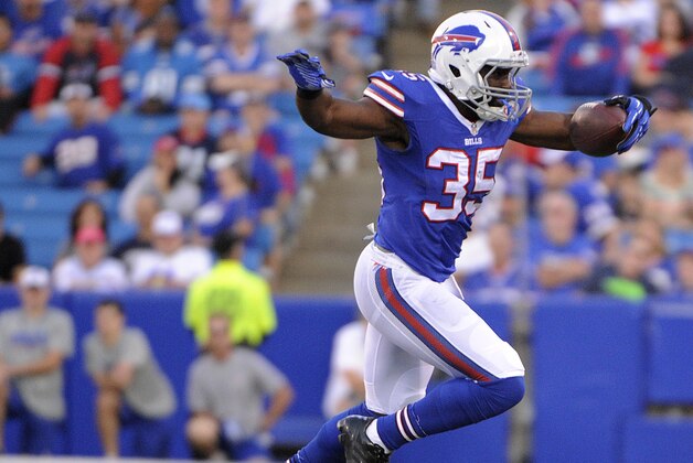 Buffalo Bills running back Bryce Brown, top, avoids a tackle by Detroit Lions cornerback Bill Bentley during the first half of a preseason NFL football game, Thursday, Aug. 28, 2014, in Orchard Park, N.Y. (AP Photo/Gary Wiepert)