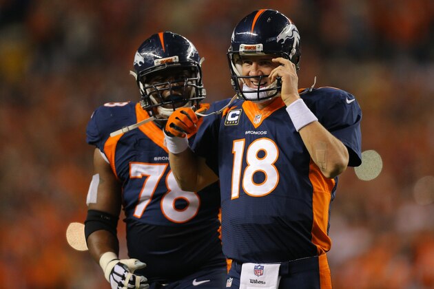 DENVER, CO - OCTOBER 19: Quarterback Peyton Manning #18 of the Denver Broncos smiles after throwing his NFL record 509th career touchdown pass in the second quarter of a game against the San Francisco 49ers at Sports Authority Field at Mile High on October 19, 2014 in Denver, Colorado.  (Photo by Justin Edmonds/Getty Images)