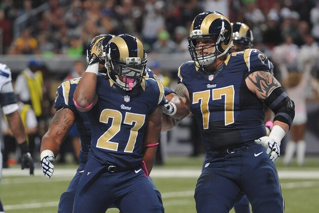 ST. LOUIS, MO - OCTOBER 19: Tre Mason #27 of the St. Louis Rams celebrates a first-quarter touchdown against the Seattle Seahawks at the Edward Jones Dome on October 19,  2014 in St. Louis, Missouri.  (Photo by Michael B. Thomas/Getty Images)