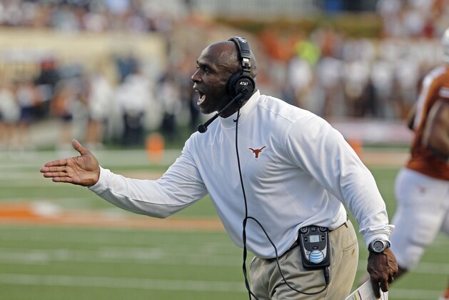 Texas head coach Charlie Strong shouts to his team during the first quarter of an NCAA college football game against BYU in Austin, Texas, Saturday,  Sept. 6, 2014.  (AP Photo/Michael Thomas)
