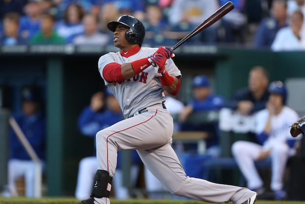 KANSAS CITY, MO - SEPTEMBER 13:  Yoenis Cespedes #52 of the Boston Red Sox hits a sacrifice fly in the third inning against the Kansas City Royals  at Kauffman Stadium on September 13, 2014 in Kansas City, Missouri. (Photo by Ed Zurga/Getty Images)