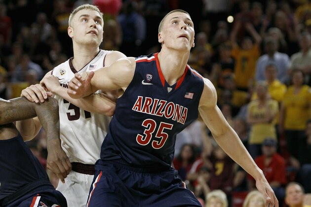 TEMPE, AZ - FEBRUARY 14:  Kaleb Tarczewski #35 of the Arizona Wildcats and Jonathan Gilling #31 of the Arizona State Sun Devils battle for position under the basket during the second half of a college basketball game at Wells Fargo Arena on February 14, 2014 in Tempe, Arizona.  (Photo by Ralph Freso/Getty Images)