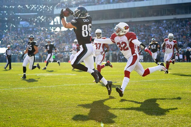 PHILADELPHIA, PA - DECEMBER 01:  Zach Ertz #86 of the Philadelphia Eagles catches a touchdown pass from Nick Foles #9 as Tyrann Mathieu #32 of the Arizona Cardinals prepares to tackle during the first quarter at Lincoln Financial Field on December 1, 2013 in Philadelphia, Pennsylvania.  (Photo by Maddie Meyer/Getty Images)