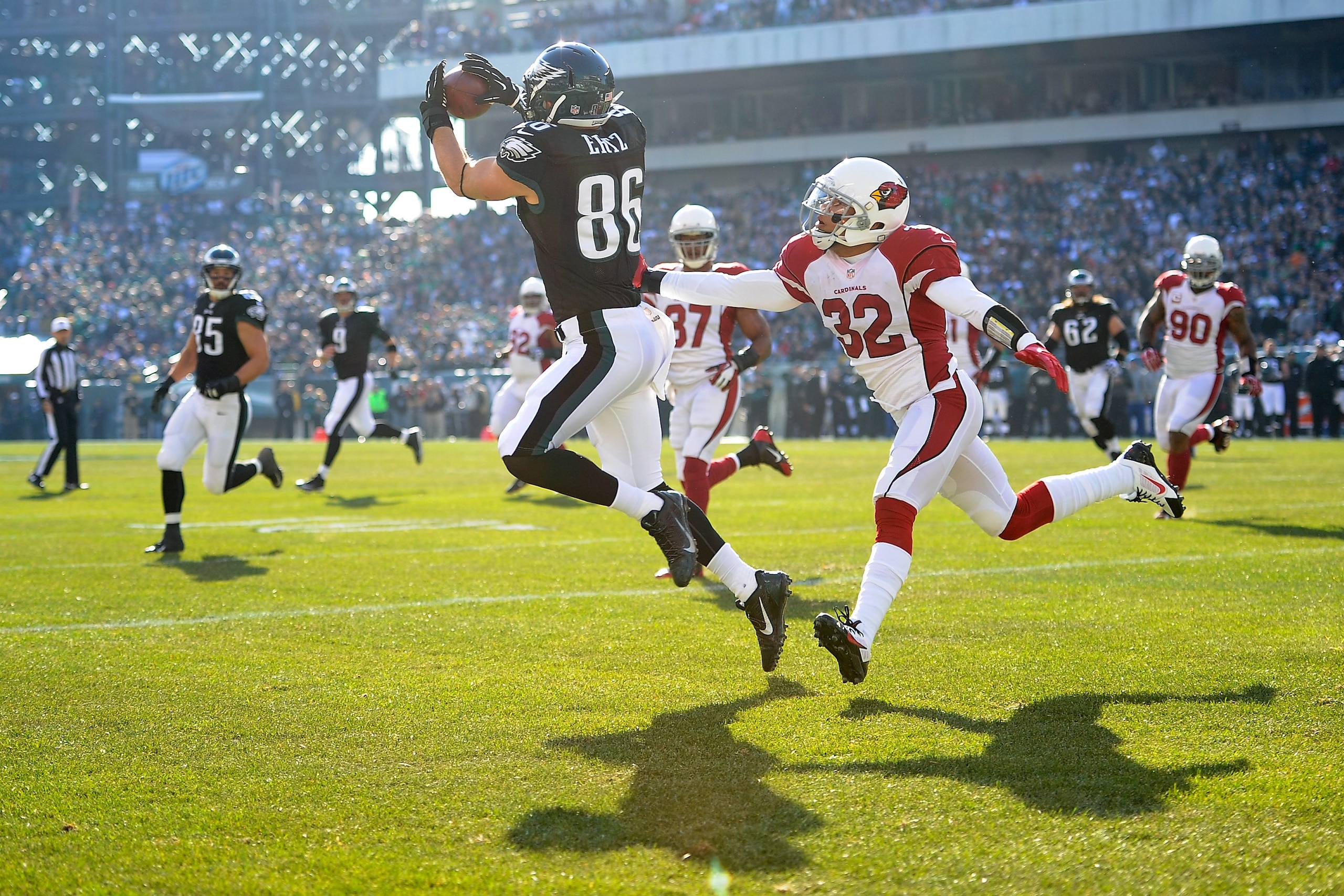 PHILADELPHIA, PA - DECEMBER 01:  Zach Ertz #86 of the Philadelphia Eagles catches a touchdown pass from Nick Foles #9 as Tyrann Mathieu #32 of the Arizona Cardinals prepares to tackle during the first quarter at Lincoln Financial Field on December 1, 2013 in Philadelphia, Pennsylvania.  (Photo by Maddie Meyer/Getty Images)