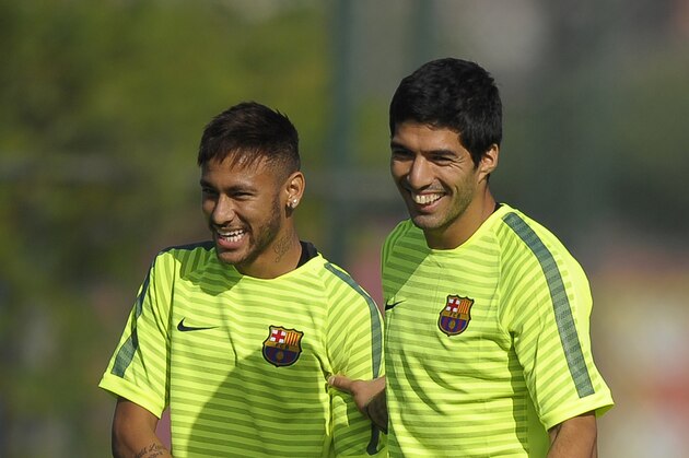 FC Barcelona's Luis Suarez, from Uruguay, right, and Neymar, from Brazil, attend a training session at the Sports Center FC Barcelona Joan Gamper in San Joan Despi, Spain, Monday, Oct. 20, 2014. FC Barcelona will play against Ajax in a group F Champions League on Tuesday Oct. 21. (AP Photo/Manu Fernandez)