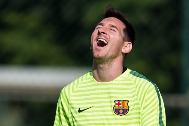 BARCELONA, SPAIN - OCTOBER 20:  Lionel Messi of FC Barcelona smiles during a training session ahead of their UEFA Champions League Group F match against AFC Ajax at Ciutat Esportiva on October 20, 2014 in Barcelona, Spain.  (Photo by David Ramos/Getty Images)