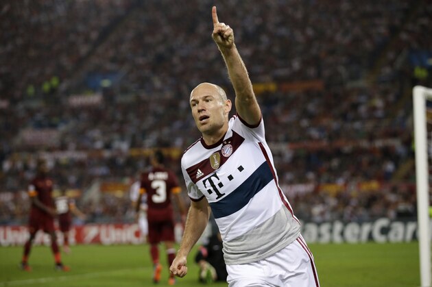Bayern's Arjen Robben celebrates after scoring his sides fourth goal during the Group E Champions League soccer match between Roma and Bayern Munich at the Olympic stadium, in Rome, Tuesday, Oct. 21, 2014. (AP Photo/Andrew Medichini)