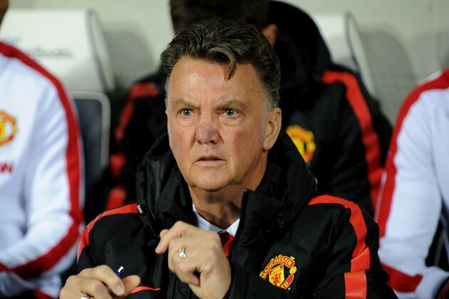 Manchester United manager Louis van Gaal watches in the dug out during the English Premier League soccer match between West Bromwich Albion and Manchester United at the Hawthorns, Birmingham, England, Monday, Oct. 20, 2014. (AP Photo/Rui Vieira)