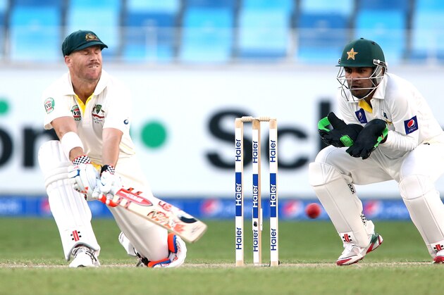 DUBAI, UNITED ARAB EMIRATES - OCTOBER 23: David Warner of Australia reverse sweeps the ball to bring up his half century during Day Two of the First Test between Pakistan and Australia at Dubai International Stadium at Dubai International Stadium on October 23, 2014 in Dubai, United Arab Emirates. (Photo by Warren Little/Getty Images) DUBAI, UNITED ARAB EMIRATES - OCTOBER 23: David Warner of Australia reverse sweeps the ball to bring up his half century during Day Two of the First Test between Pakistan and Australia at Dubai International Stadium at Dubai International Stadium on October 23, 2014 in Dubai, United Arab Emirates. (Photo by Warren Little/Getty Images)