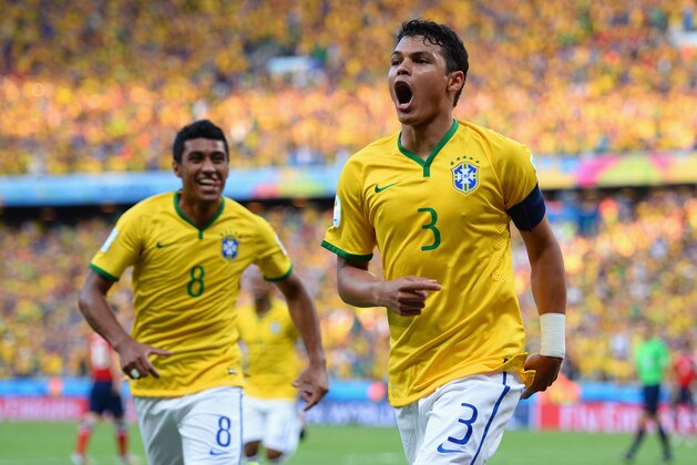 FORTALEZA, BRAZIL - JULY 04:  Thiago Silva of Brazil (R) celebrates scoring his team's first goal during the 2014 FIFA World Cup Brazil Quarter Final match between Brazil and Colombia at Castelao on July 4, 2014 in Fortaleza, Brazil.  (Photo by Jamie McDonald/Getty Images)