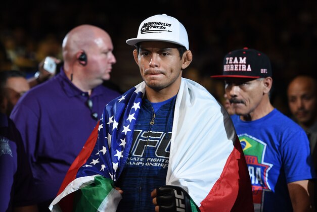 August 30, 2014; Sacramento, CA, USA; Carlos Diego Ferreira (blue gloves) fights Ramsey Nijem (red gloves)  during the lightweight bout of UFC 177 at Sleep Train Arena. Mandatory Credit: Kyle Terada-USA TODAY Sports