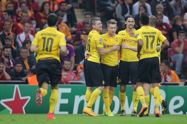 Borussia Dortmund players celebrate their second goal during Champions League Group D soccer match with Galatasaray at the Turk Telekom Arena Stadium in Istanbul, Turkey, Wednesday, Oct. 22, 2014. (AP Photo)