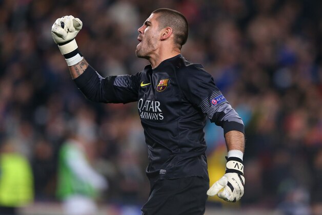 BARCELONA, SPAIN - MARCH 12:  Victor Valdes of FC Barcelona celebrates the second goal during the UEFA Champions League Round of 16 match between FC Barcelona and Manchester City at Camp Nou on March 12, 2014 in Barcelona, Spain.  (Photo by Alex Livesey/Getty Images)