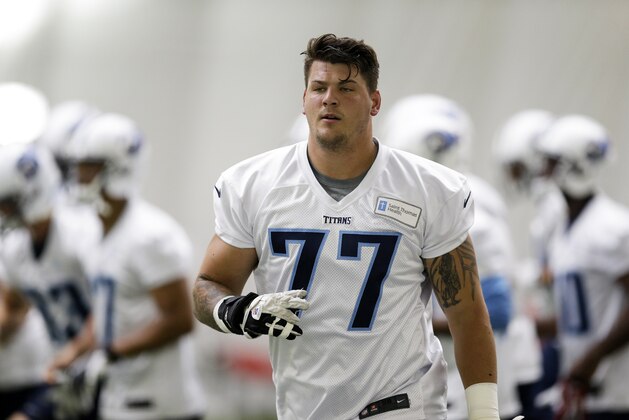 Tennessee Titans offensive tackle Taylor Lewan (77) warms up during NFL football minicamp on Monday, June 9, 2014, in Nashville, Tenn. (AP Photo/Mark Humphrey)