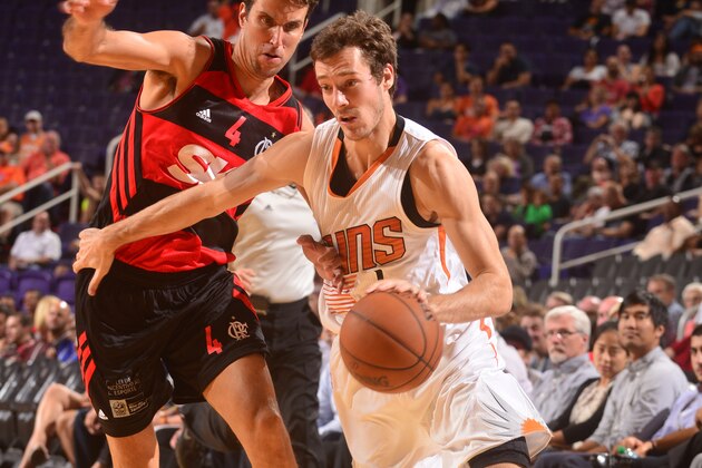 PHOENIX, AZ - OCTOBER 8: Goran Dragic #1 of the Phoenix Suns drives against Marcellinho Machado #4 of Flamengo during a preseason game on October 8, 2014 at U.S. Airways Center in Phoenix, Arizona. NOTE TO USER: User expressly acknowledges and agrees that, by downloading and or using this photograph, user is consenting to the terms and conditions of the Getty Images License Agreement. Mandatory Copyright Notice: Copyright 2014 NBAE (Photo by Barry Gossage/NBAE via Getty Images)