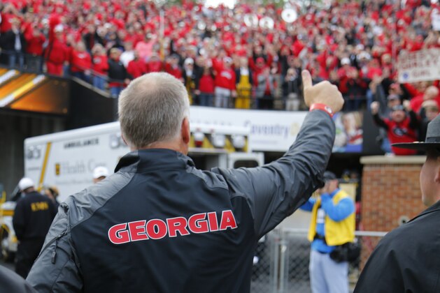 COLUMBIA, MO - OCTOBER 11: Head coach Mark Richt of the Georgia Bulldogs celebrates the victory and acknowledges the Georgia Bulldogs fans that travelled on October 11, 2014 at Faurot Field/Memorial Stadium in Columbia, Missouri. (Photo by Kyle Rivas/Getty Images)