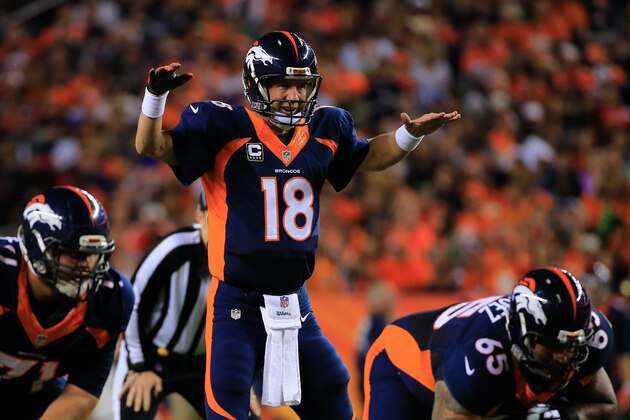 DENVER, CO - OCTOBER 19:  Quarterback Peyton Manning #18 of the Denver Broncos runs the offense against the San Francisco 49ers during a game at Sports Authority Field at Mile High on October 19, 2014 in Denver, Colorado.  (Photo by Doug Pensinger/Getty Images)