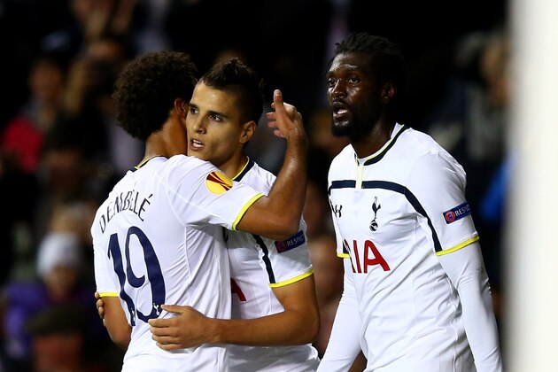 LONDON, ENGLAND - OCTOBER 23:  Erik Lamela of Spurs celebrates with team-mates Emmanuel Adebayour and Mousa Dembele after scoring his team's third goal during the UEFA Europa League group C match between Tottenham Hotspur FC and Asteras Tripolis FC at White Hart Lane on October 23, 2014 in London, United Kingdom.  (Photo by Clive Rose/Getty Images)