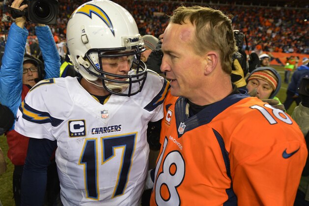 FILE - In this Jan. 12, 2014, file photo, San Diego Chargers quarterback Philip Rivers, left, and Denver Broncos quarterback Peyton Manning greet each other at midfield after the Broncos beat the Chargers 24-17 in an NFL AFC division playoff football game in Denver. The Broncos fear no one in the AFC, nor should they given their recent record. There is one opponent that gets Peyton Manning and company a bit unsettled, though, and that's who they take on Thursday night, Oct. 23, 2014, when the San Diego Chargers come visiting. (AP Photo/Jack Dempsey, File)
