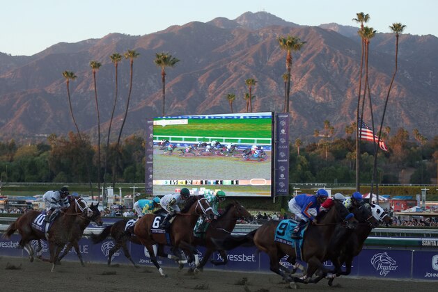 ARCADIA, CA - NOVEMBER 02:  Jockey Mike Smith atop Game On Dude leads the field down the front stretch of the Classic during the 2013 Breeders' Cup World Championships at Santa Anita Park on November 2, 2013 in Arcadia, California.  (Photo by Jeff Gross/Getty Images)