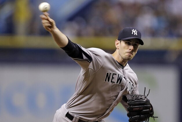 New York Yankees starting pitcher Brandon McCarthy delivers to the Tampa Bay Rays during the first inning of a baseball game Wednesday, Sept. 17, 2014, in St. Petersburg, Fla. (AP Photo/Chris O'Meara)