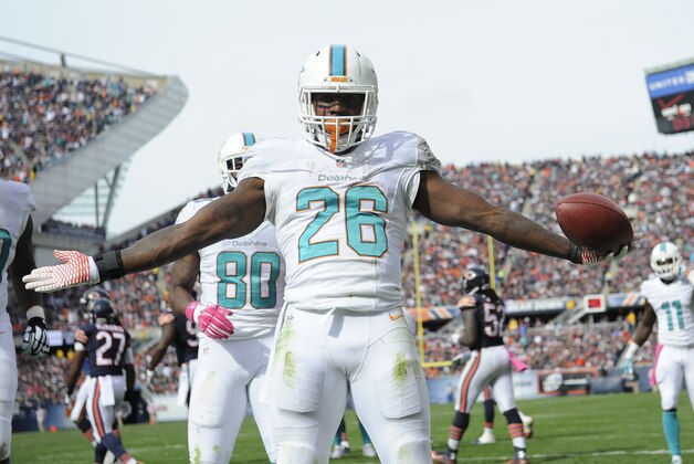 CHICAGO, IL- OCTOBER 19: Lamar Miller #26 of the Miami Dolphins scores a touchdown against the Chicago Bears on October 19, 2014 at Soldier Field in Chicago, Illinois.  (Photo by David Banks/Getty Images)
