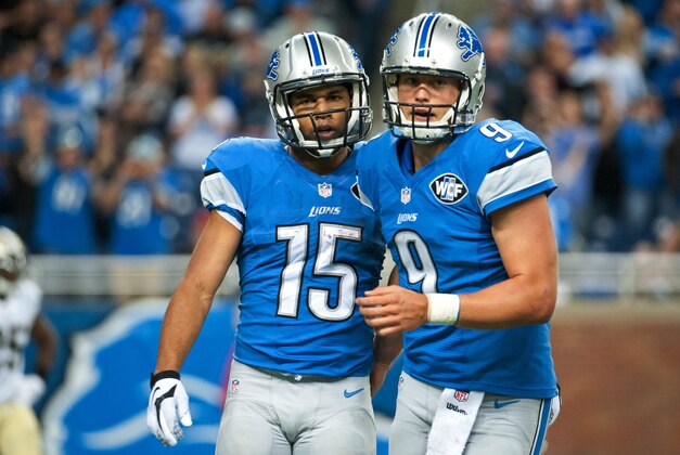Oct 19, 2014; Detroit, MI, USA; Detroit Lions wide receiver Golden Tate (15) celebrates his touchdown with quarterback Matthew Stafford (9) during the fourth quarter against the New Orleans Saints at Ford Field. Detroit won 24-23. Mandatory Credit: Tim Fuller-USA TODAY Sports