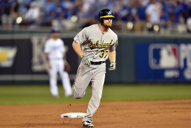 Sep 30, 2014; Kansas City, MO, USA; Oakland Athletics designated hitter Brandon Moss (37) rounds the bases after hitting a two-run home run against the Kansas City Royals during the first inning of the 2014 American League Wild Card playoff baseball game at Kauffman Stadium. Mandatory Credit: Peter G. Aiken-USA TODAY Sports