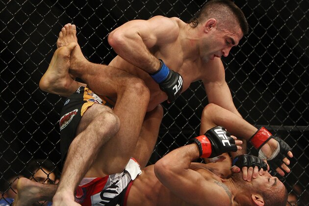 Jose Aldo, right, of Brazil and Ricardo Lamas of Chicago, IL fight in the fifth round of the Ultimate Fighting Featherweight Championship Mix Martial Arts bout in Newark, N.J. on Saturday, Feb. 1, 2014. Aldo won by unanimous decision in five rounds. (AP Photo/Tim Larsen)