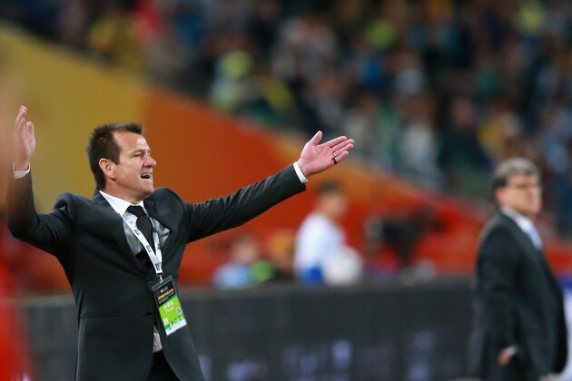 BEIJING, CHINA - OCTOBER 11:  Dunga, head coach of Brazil (Left) and Gerardo Martino, head coach of Argentina (Right) react during Super Clasico de las Americas between Argentina and Brazil at Beijing National Stadium on October 11, 2014 in Beijing, China.  (Photo by Feng Li/Getty Images)