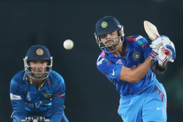 DHAKA, BANGLADESH - APRIL 06:  Virat Kohli of India bats as Kumar Sangakkara of Sri Lanka looks on during the Final of the ICC World Twenty20 Bangladesh 2014 between India and Sri Lanka at Sher-e-Bangla Mirpur Stadium on April 4, 2014 in Dhaka, Bangladesh.  (Photo by Scott Barbour/Getty Images)