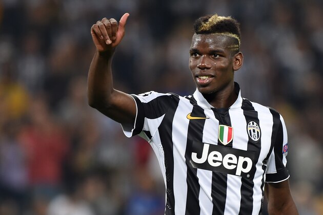 TURIN, ITALY - SEPTEMBER 16:  Paul Pogba of Juventus salutes the fans at the end of the UEFA Champions League Group A match between Juventus and Malmo FF on September 16, 2014 in Turin, Italy.  (Photo by Valerio Pennicino/Getty Images)