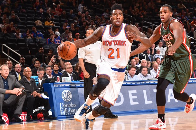 NEW YORK, NY - OCTOBER 20:  Iman Shumpert #21 of the New York Knicks dribbles against Khris Middleton #22 of the Milwaukee Bucks on October 20, 2014 at Madison Square Garden in New York City. NOTE TO USER: User expressly acknowledges and agrees that, by downloading and or using this photograph, User is consenting to the terms and conditions of the Getty Images License Agreement. Mandatory Copyright Notice: Copyright 2014 NBAE (Photo by Jesse D. Garrabrant/NBAE via Getty Images)