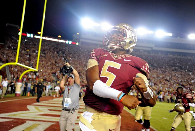Oct 18, 2014; Tallahassee, FL, USA; Florida State Seminoles quaterback Jameis Winston (5) celebrates after beating the Notre Dame Fighting Irish 31-27 at Doak Campbell Stadium. Mandatory Credit: Melina Vastola-USA TODAY Sports