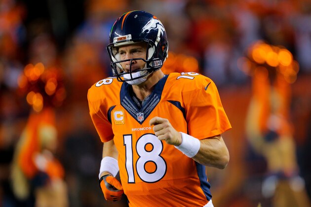 DENVER, CO - OCTOBER 23:  Quarterback Peyton Manning #18 of the Denver Broncos runs onto the field during player introductions before a game against the San Diego Chargers at Sports Authority Field at Mile High on October 23, 2014 in Denver, Colorado.  (Photo by Justin Edmonds/Getty Images)