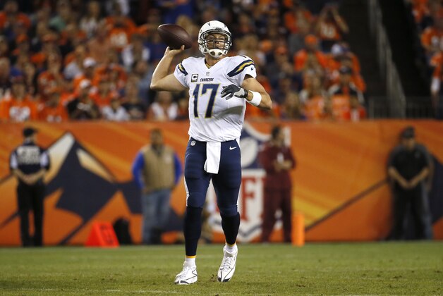 San Diego Chargers quarterback Philip Rivers (17) throws against the Denver Broncos during the first half of an NFL football game, Thursday, Oct. 23, 2014, in Denver. (AP Photo/Jack Dempsey)