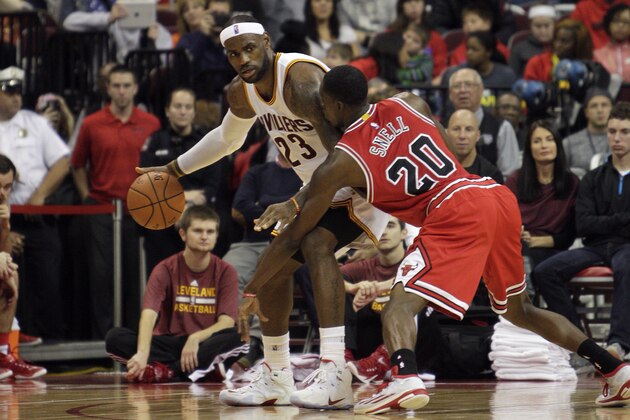 Cleveland Cavaliers' LeBron James, left, drives against Chicago Bulls' Tony Snell in an NBA preseason basketball game Monday, Oct. 20, 2014, in Columbus, Ohio. (AP Photo/Jay LaPrete)