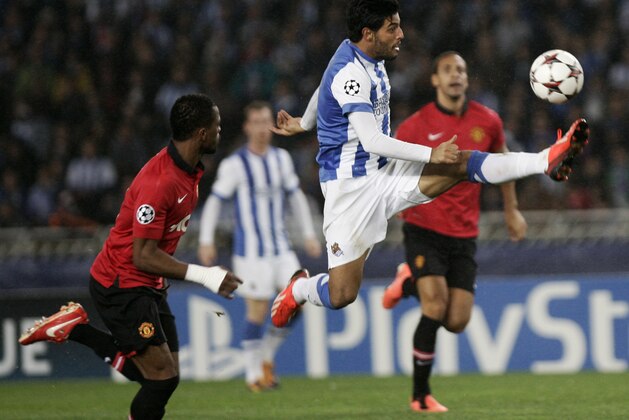 FILE - In this Nov. 5, 2013 file photo, Real Sociedad's Carlos Vela, center, jumps to control the ball during a Champion's League Group A soccer match against Manchester United in San Sebastian, Spain. The Mexican Football Association confirmed Monday, Feb. 3, 2014, that Vela will not play for Mexico in the 2014 World Cup in Brazil. (AP Photo/Gaizka Bilbao, File)