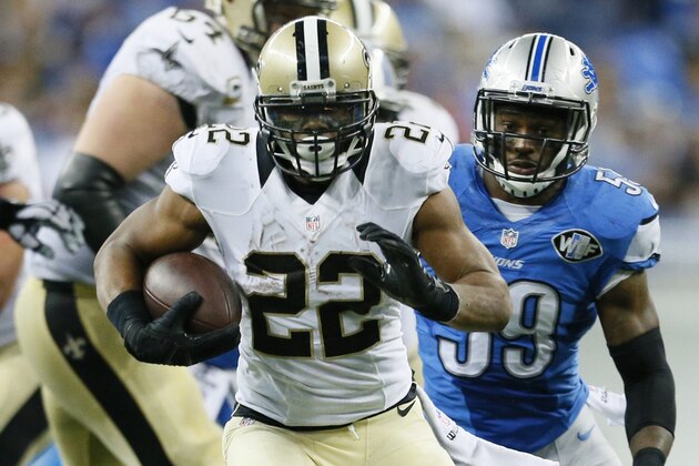 New Orleans Saints running back Mark Ingram (22) pulls away from Detroit Lions outside linebacker Tahir Whitehead (59) during the second half of an NFL football game in Detroit, Sunday, Oct. 19, 2014. (AP Photo/Rick Osentoski)