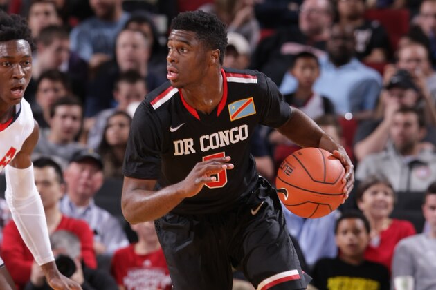 PORTLAND, OR - APRIL 12:  Emmanuel Mudiay #5 of the World Team dribbles the ball during the game against Team USA on April 12, 2014 at the Moda Center Arena in Portland, Oregon. NOTE TO USER: User expressly acknowledges and agrees that, by downloading and or using this photograph, user is consenting to the terms and conditions of the Getty Images License Agreement. Mandatory Copyright Notice: Copyright 2014 NBAE (Photo by Sam Forencich/NBAE via Getty Images)