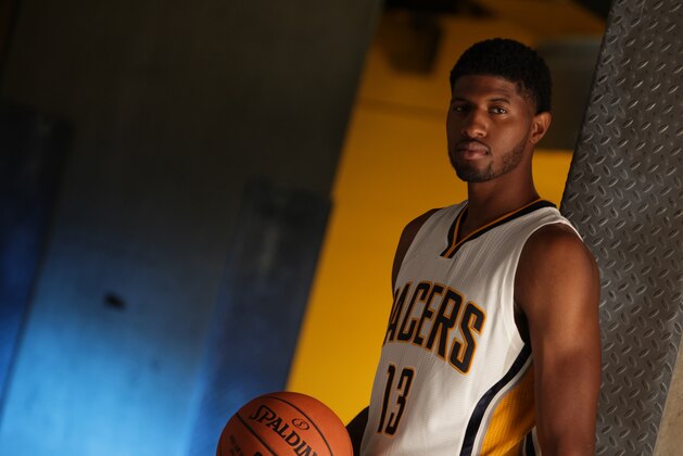 INDIANAPOLIS - SEPTEMBER 29: Paul George #13 of the Indiana Pacers during the Pacers media day at Bankers Life Fieldhouse on September 29, 2014 in Indianapolis, Indiana.  NOTE TO USER: User expressly acknowledges and agrees that, by downloading and or using this Photograph, user is consenting to the terms and condition of the Getty Images License Agreement. Mandatory Copyright Notice: 2014 NBAE  (Photo by Ron Hoskins/NBAE via Getty Images)