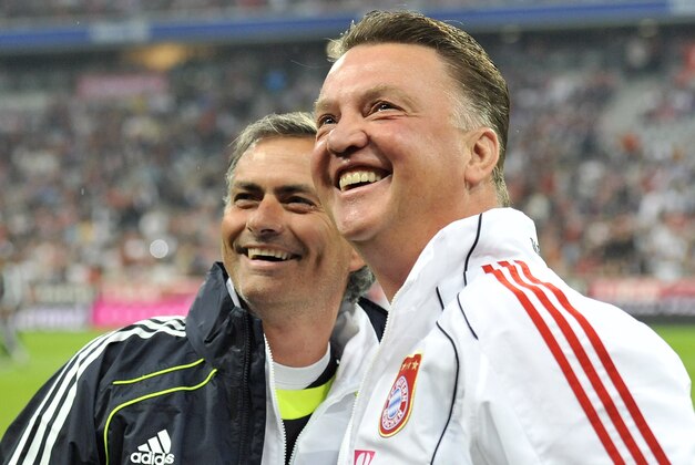 Munich's head coach Louis van Gaal, right, and Madrid's head coach Jose Mourinho looks on prior to their international friendly soccer match between FC Bayern Munich and  Real Madrid in Munich, southern Germany, Friday, Aug. 13, 2010. Fully 33 years later the farewell match will honor Franz Beckenbauer, who never received the honor when he left Munich to join the New York Cosmos, and later Hamburger SV. (AP Photo/Kerstin Joensson)