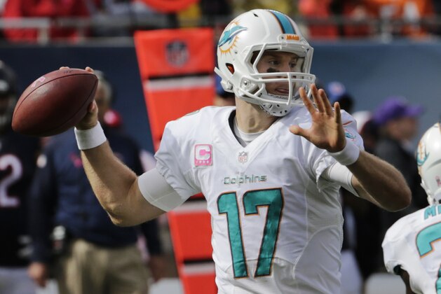 Miami Dolphins quarterback Ryan Tannehill (17) throws a pass during the first half of an NFL football game against the Chicago Bears Sunday, Oct. 19, 2014 in Chicago. (AP Photo/Charles Rex Arbogast)