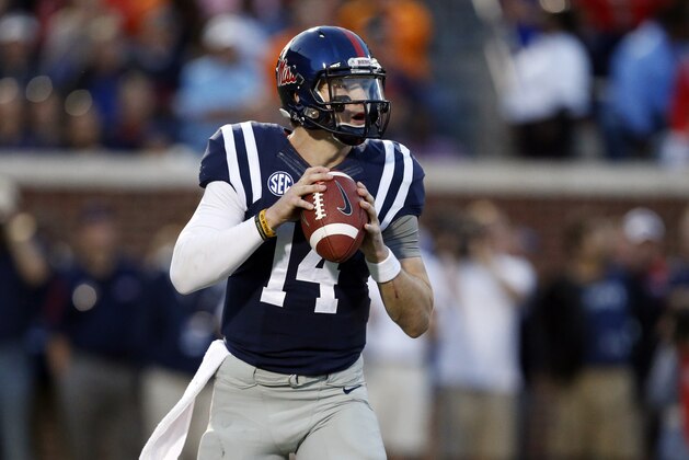Mississippi quarterback Bo Wallace (14) readies to pass against Tennessee in the first half of an NCAA college football game in Oxford, Miss., Saturday, Oct. 18, 2014. No. 3 Mississippi won 34-3. (AP Photo/Rogelio V. Solis)